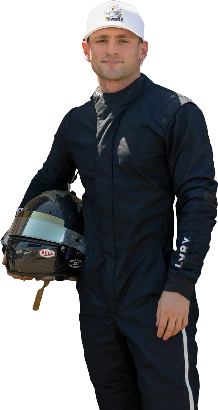 Spencer Schmidt in a race suit, holding a Bell helmet